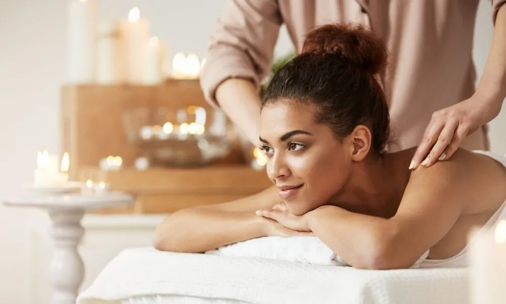 Relaxing full body spa massage therapy session with a peaceful wellness ambiance at a Coimbatore spa hotel.